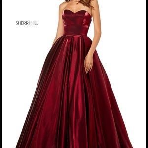 Sherri hill mattalic wine colored dress , size 2 .